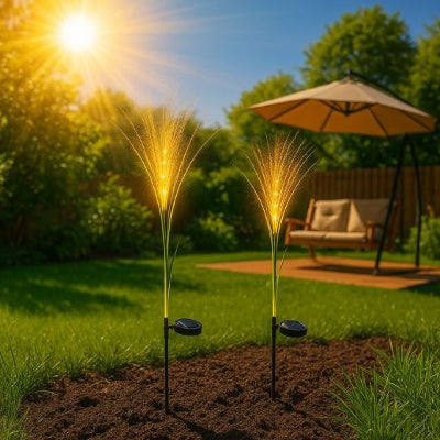 lampes jardins solaires plantées dans un massif extérieur sous la lumière du soleil