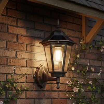 applique exterieure solaire en ABS, blanc chaud sur mur briques avec petites fleurs