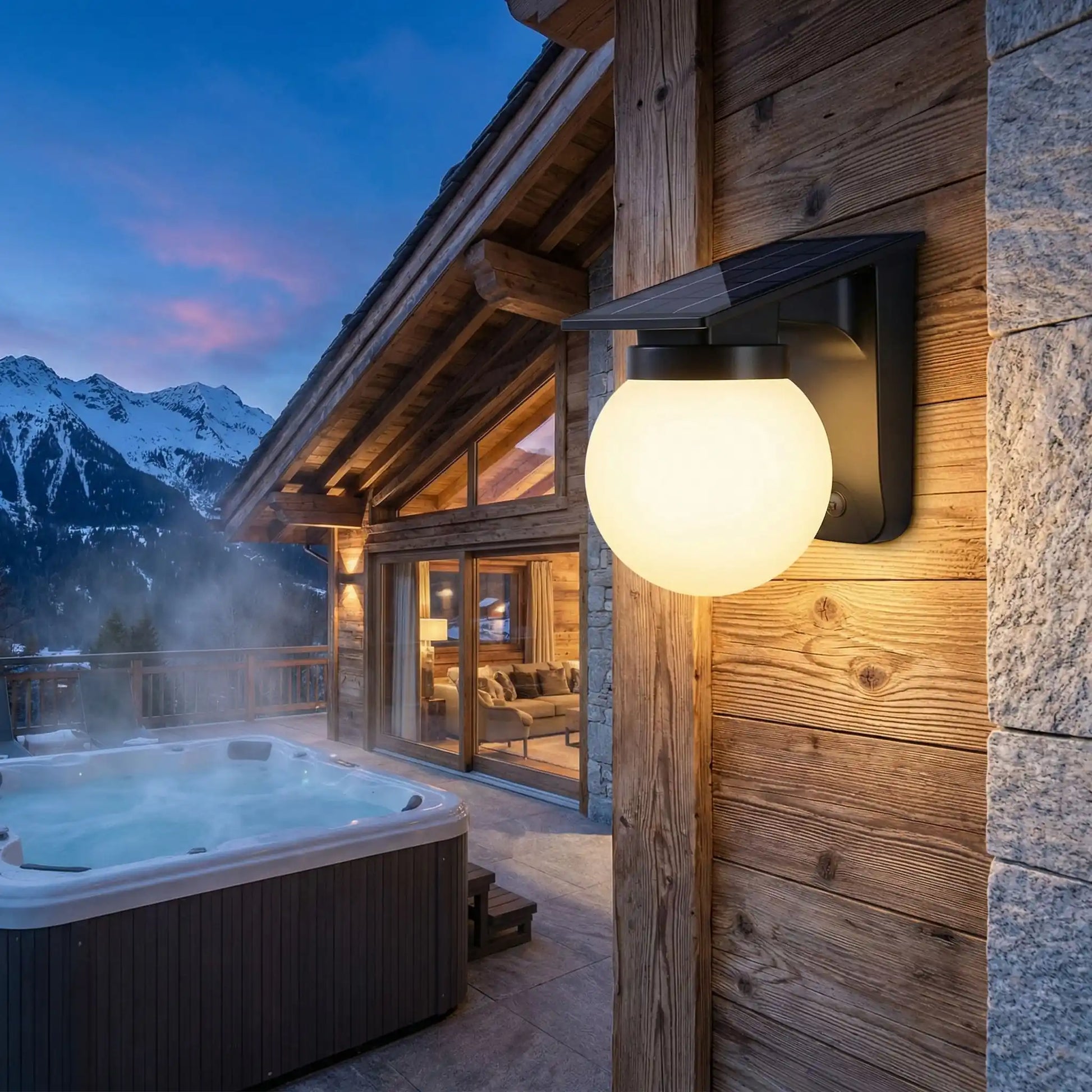 appliques exterieures solaire sur chalet alpin avec jacuzzi et vue sur montagnes enneigées