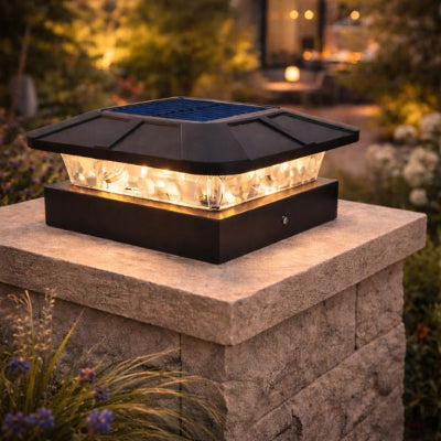 lampe exterieur solaire blanc chaud dans jardin sur pilier en pierre de taille