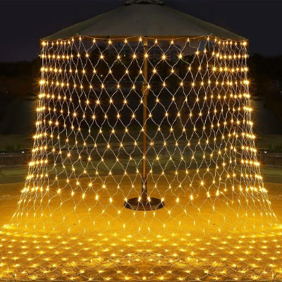 Rideau lumineux doré extérieur pour terrasse ou jardin, ambiance chaleureuse