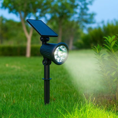 spot extérieur solaire LED orientable qui illumine plantes dans jardin